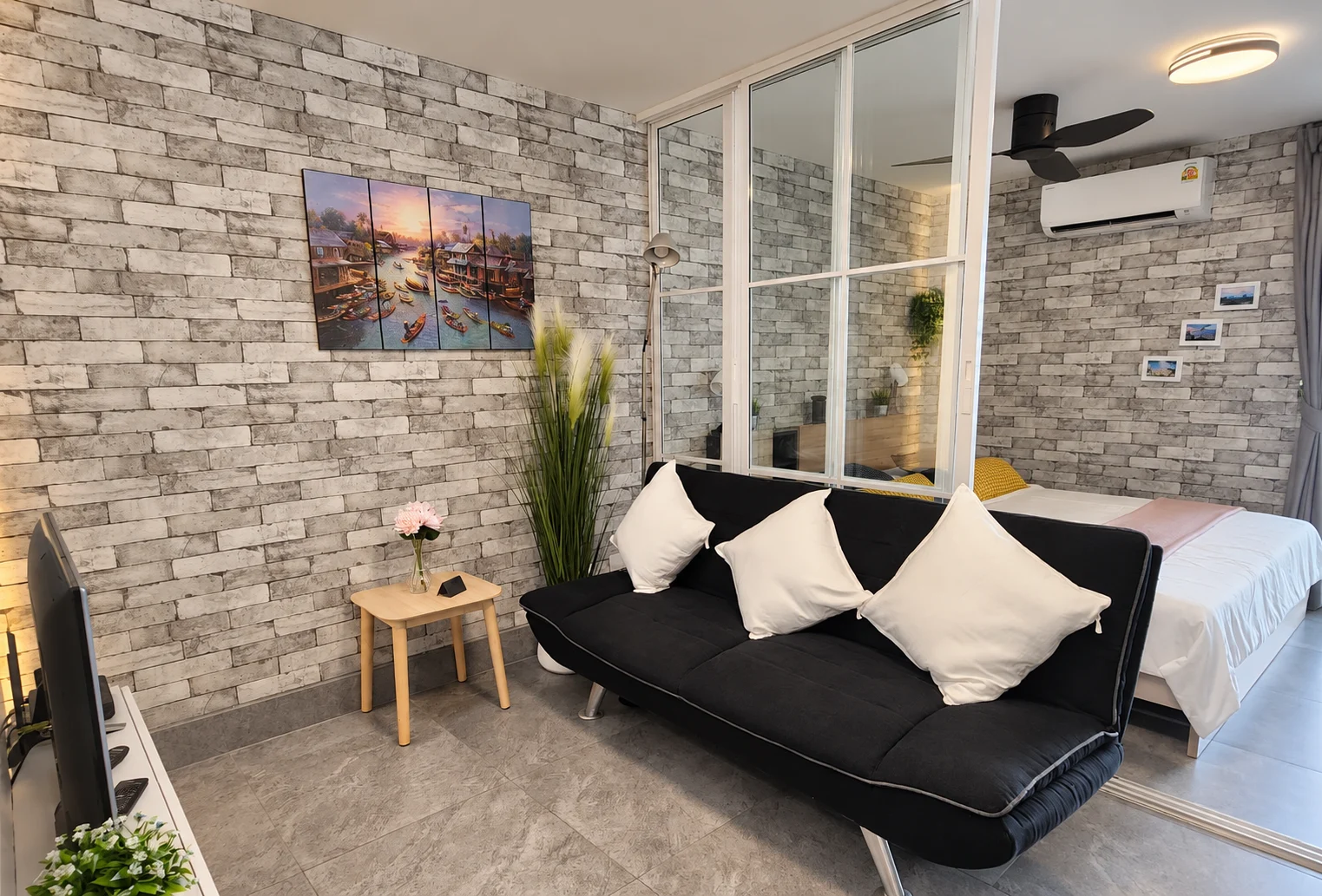 Sofa and glass partition to the bedroom